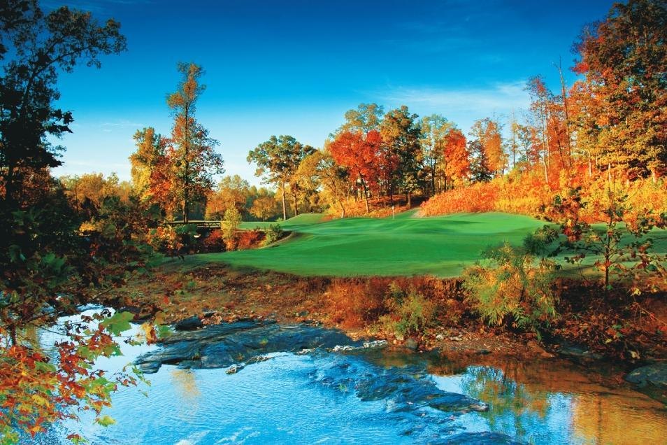 Golf hole over the water in autumn